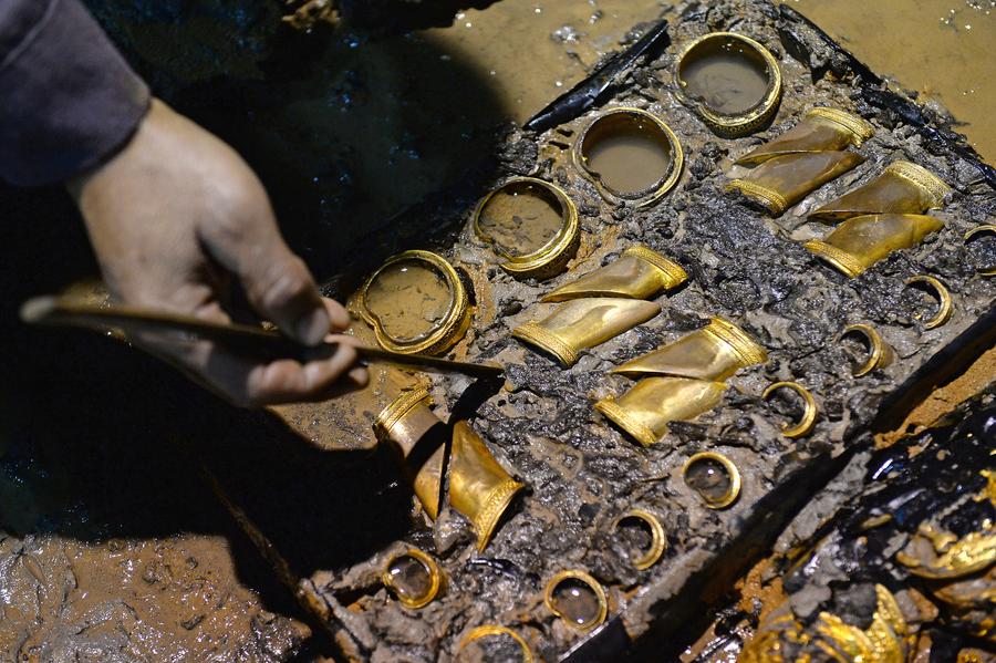 Gold coins, hoofs found in 2,000-year-old Chinese tomb