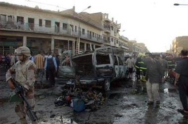 An Iraqi soldier secures the scene following an explosion in Baghdad, Wednesday, Sept. 14, 2005.