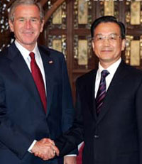 Chinese Premier Wen Jiabao told visiting US President George W. Bush at noon Sunday that China's development will "threat nobody".