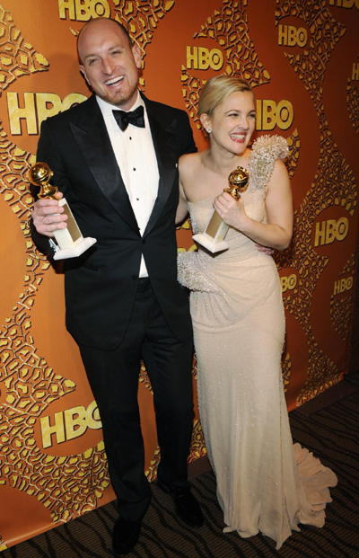 Drew Barrymore holds a Golden Globe for her work in 